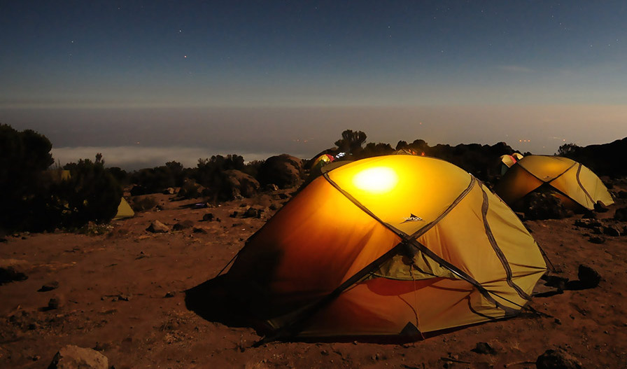 picture of a set-up camp with a beautiful night sky
